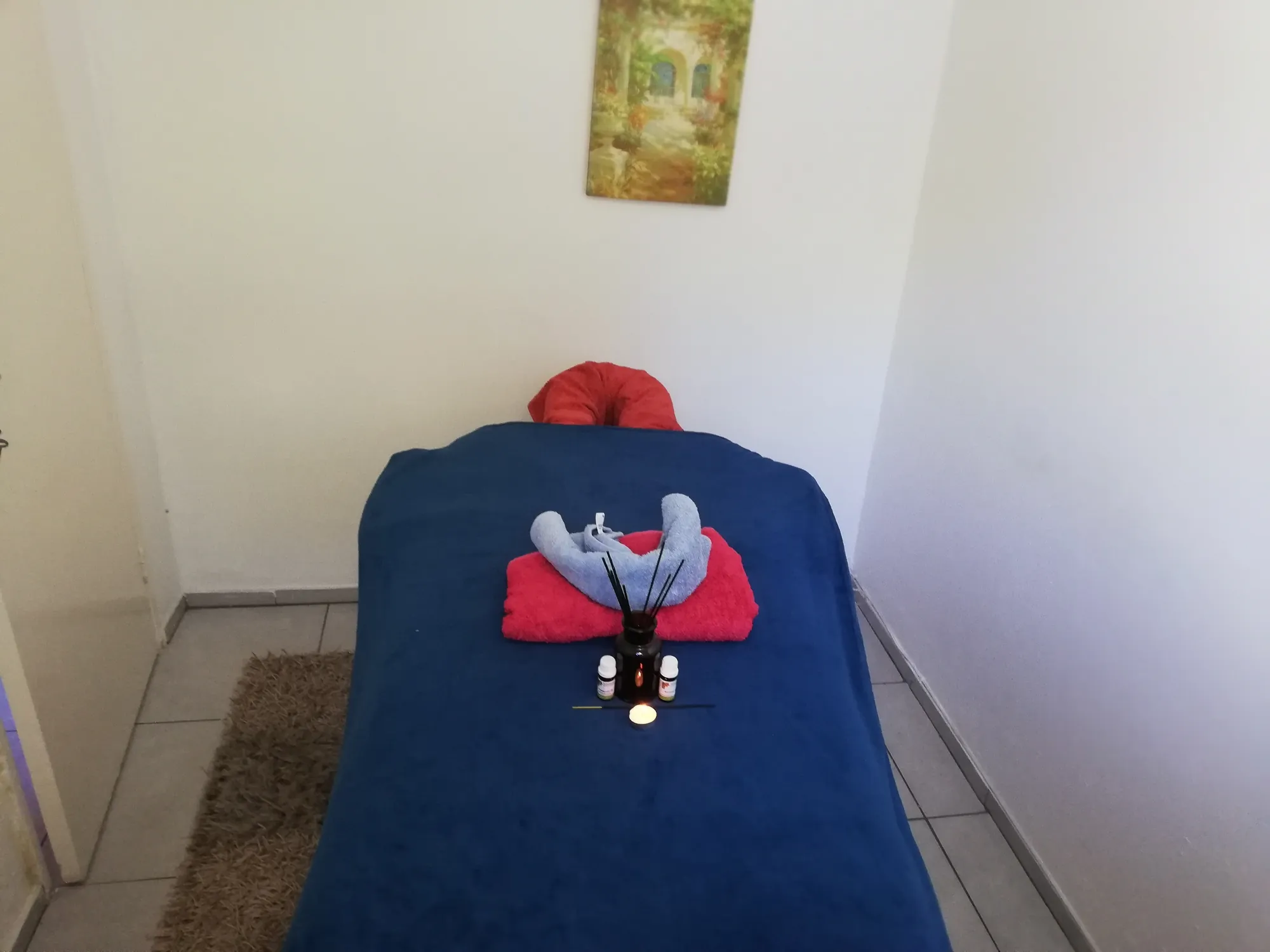 Professional spa setup - Massage treatment room with essential oils and candlelit ambience HerMasseur Bramley